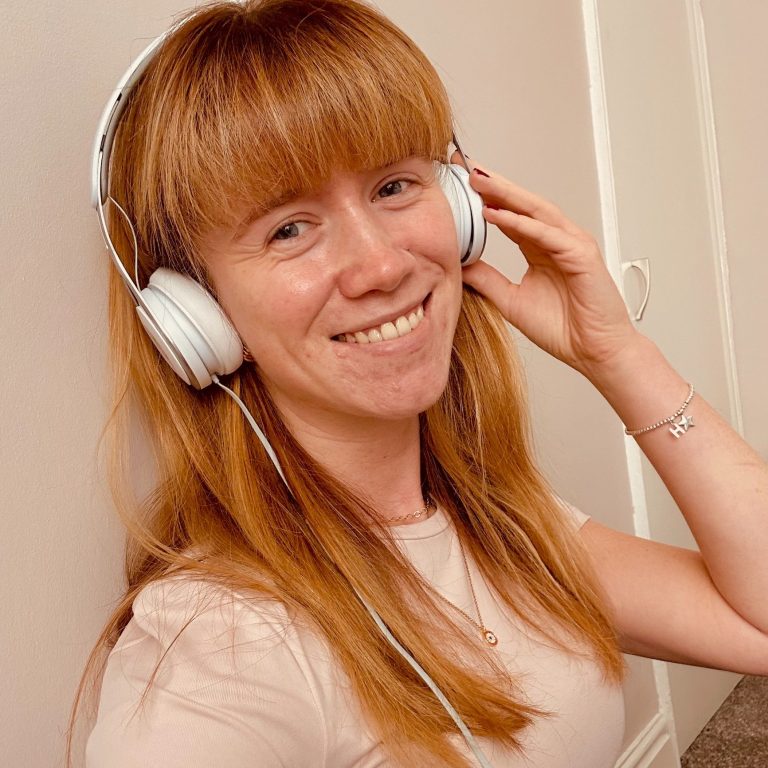 Hannah portrait with headphones listening to Spanish